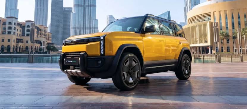 Yellow iCAUR SUV parked in a city plaza